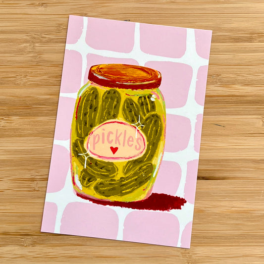 jar of pickles on pink checkered background
