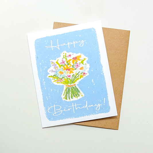 birthday card illustration of a flower bouquet and text 'happy birthday' with a Kraft envelope