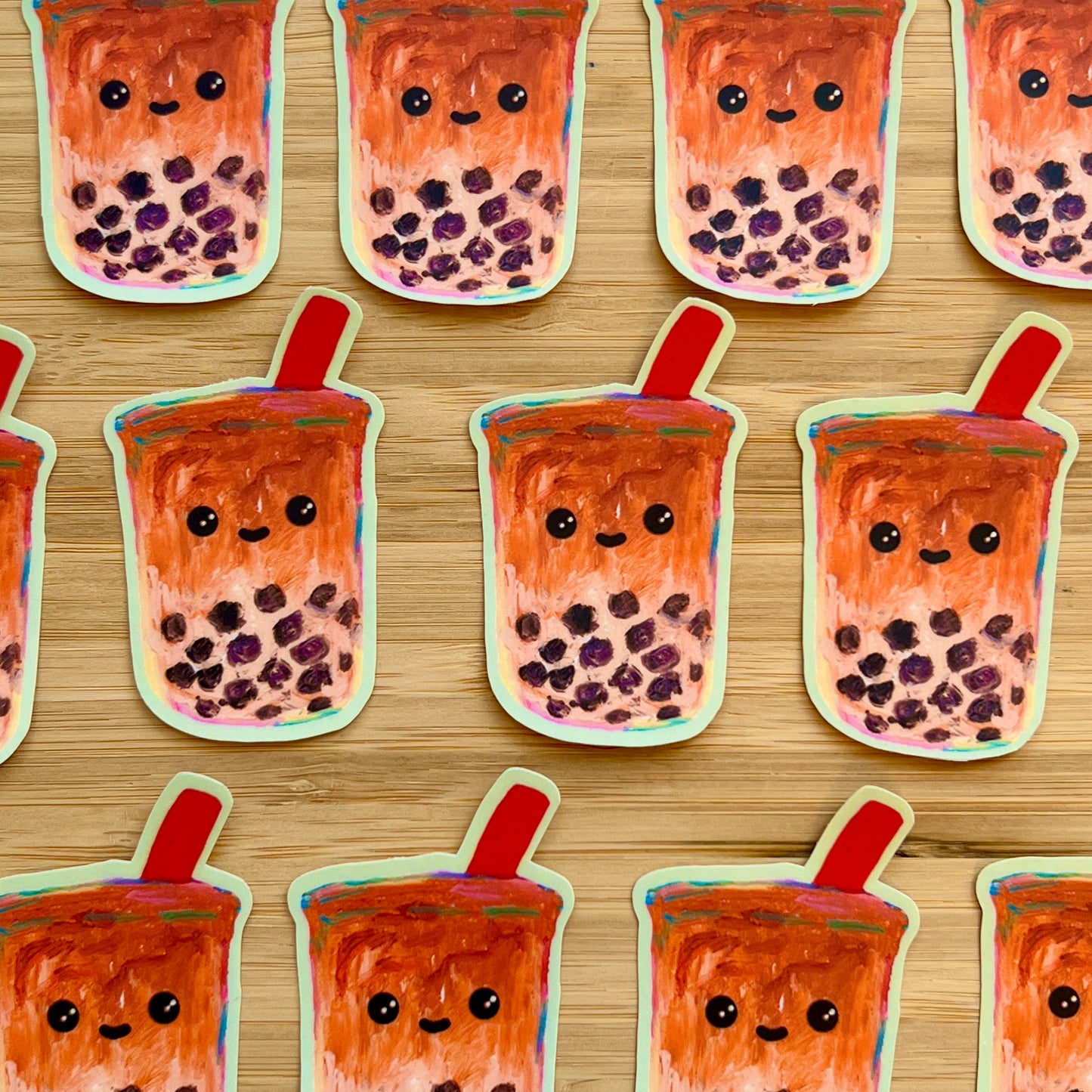 Pattern of cartoon bubble tea cups with faces on a wooden background