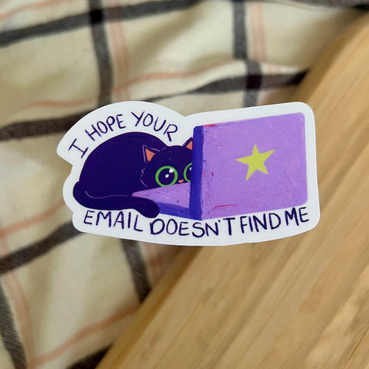 sticker of cat behind laptop with text 'I hope your email doesn't find me'