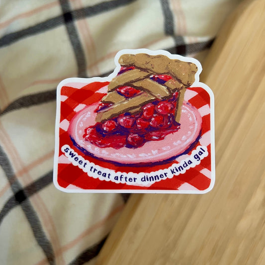 Sticker of a cherry pie with text on a checkered background