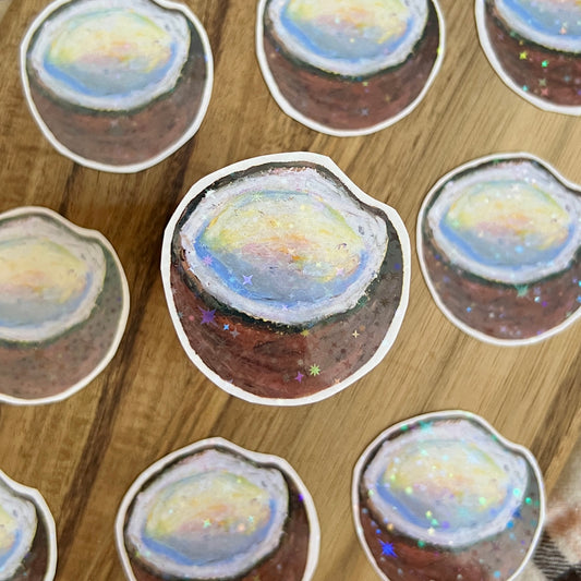 Sticker of a coconut on a wooden surface