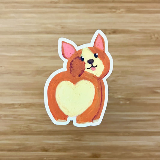 corgi butt sticker on wooden surface