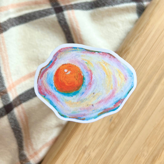 egg sticker on plaid and wooden background