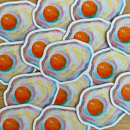 Stickers of colorful eggs illustrations on a wooden surface