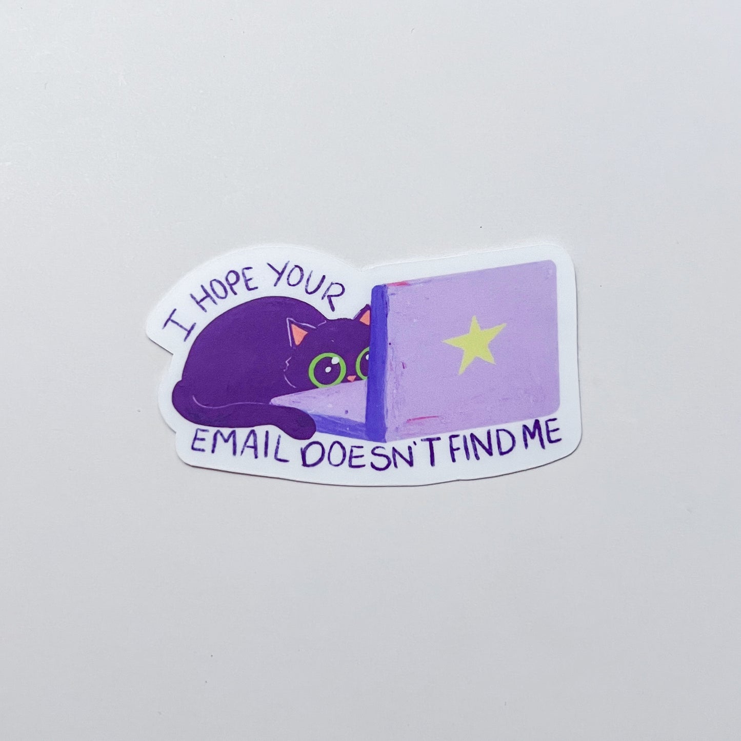 Sticker with a purple cat and text on a light gray background