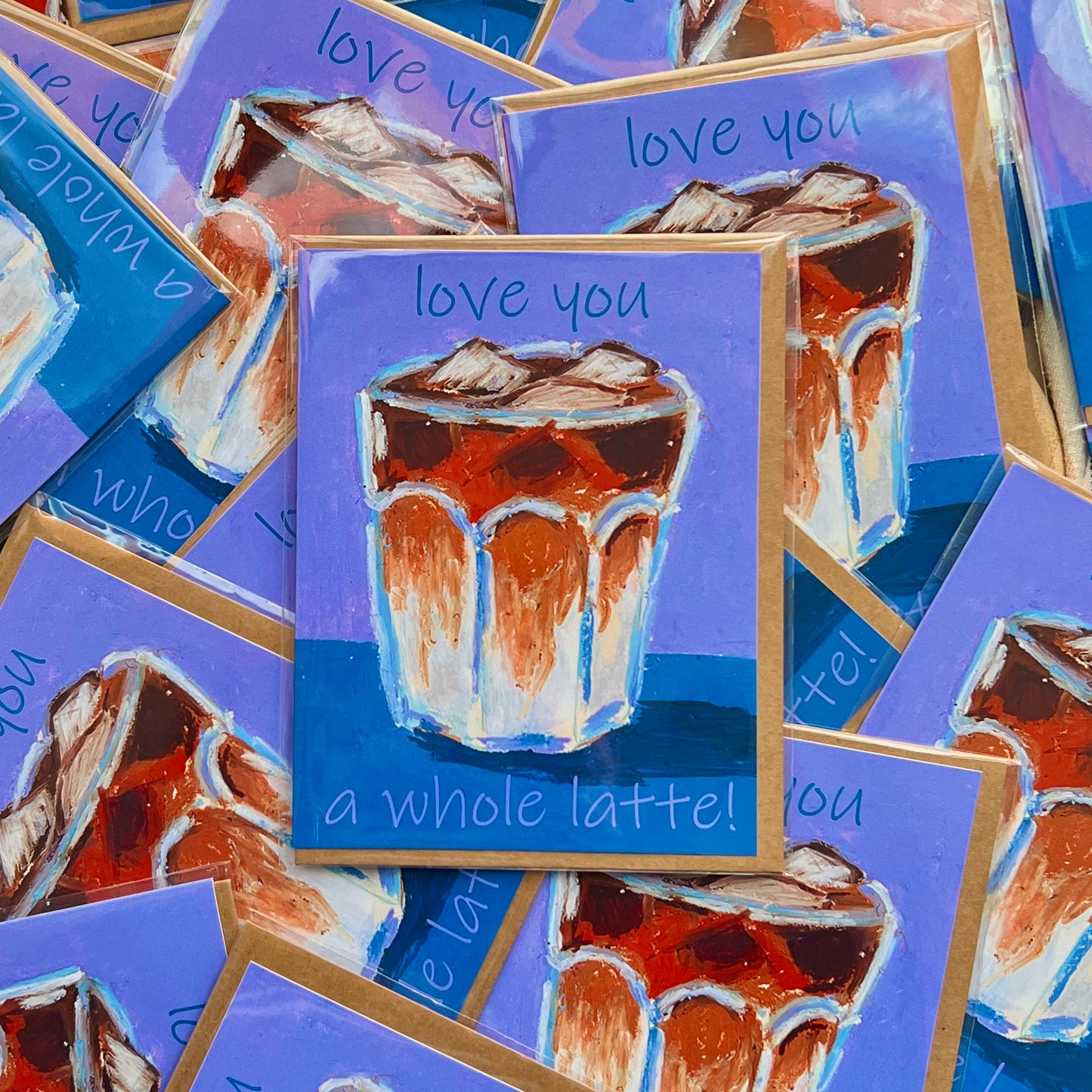 Cards with a glass of iced coffee and 'love you a whole latte!' text on a purple background.