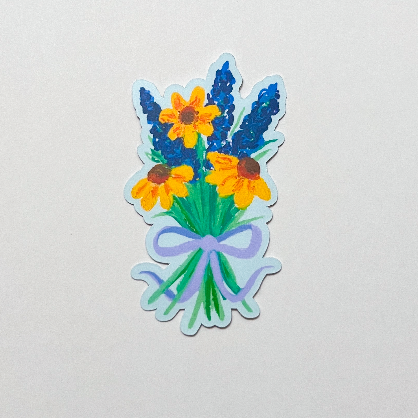 Sticker of a bouquet of flowers with a purple bow on a light gray background