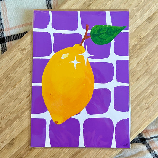 art print with a lemon illustration on a purple grid background