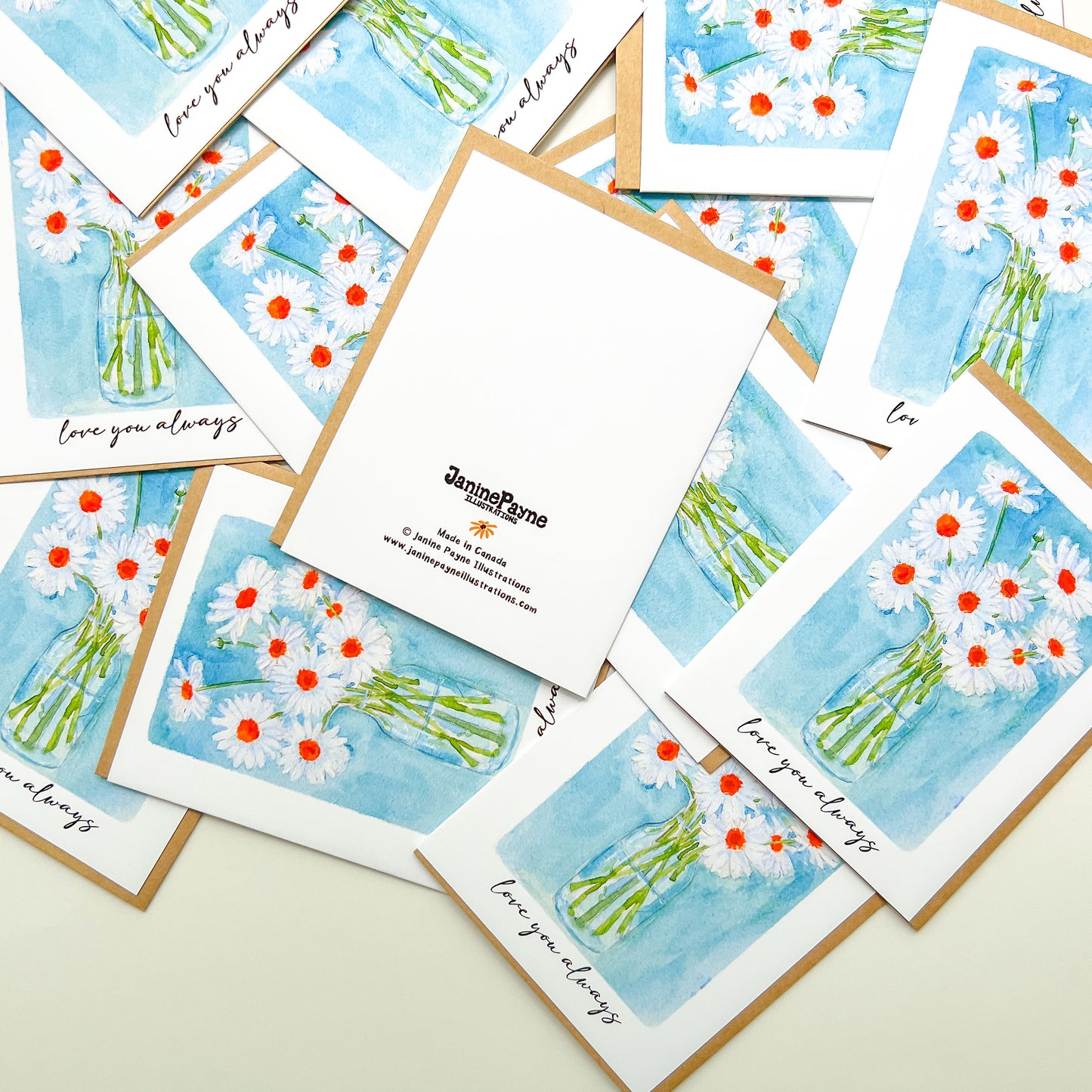 greeting cards with a vase of daisies illustration and text 'love you always' and Janine Payne Illustrations branding