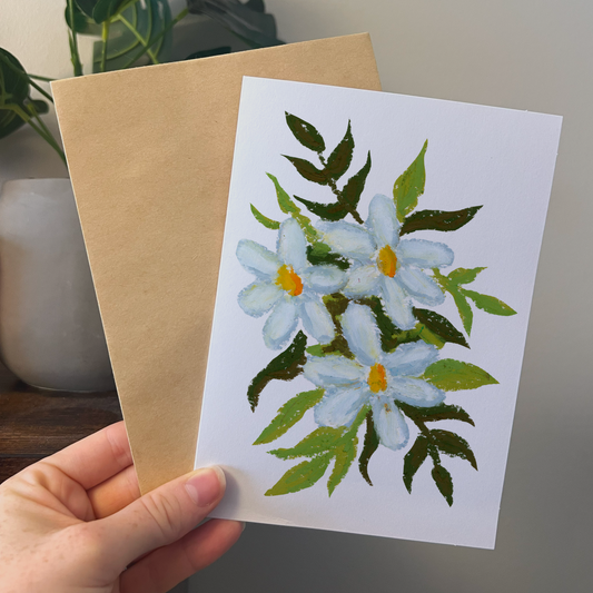 greeting card with drawing of white daisies