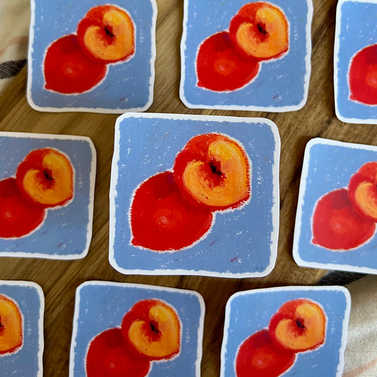 Multiple tiles with images of peaches on a wooden surface