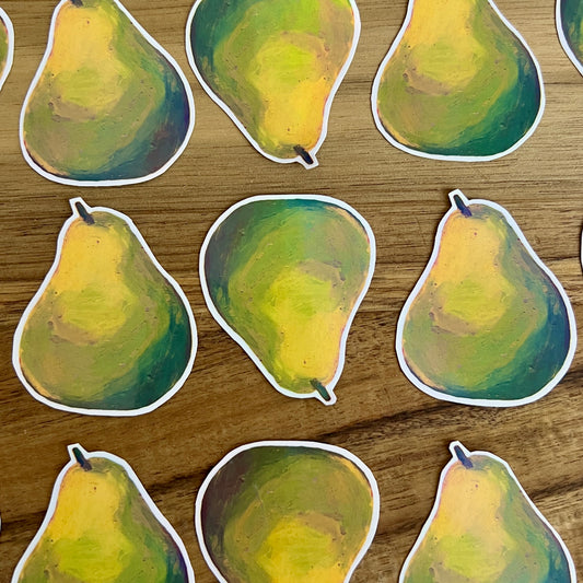 Stickers of pears on a wooden surface