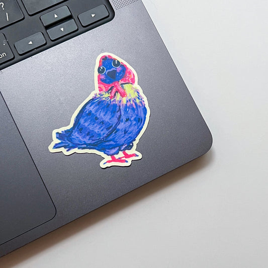 Colorful sticker of a bird on a laptop