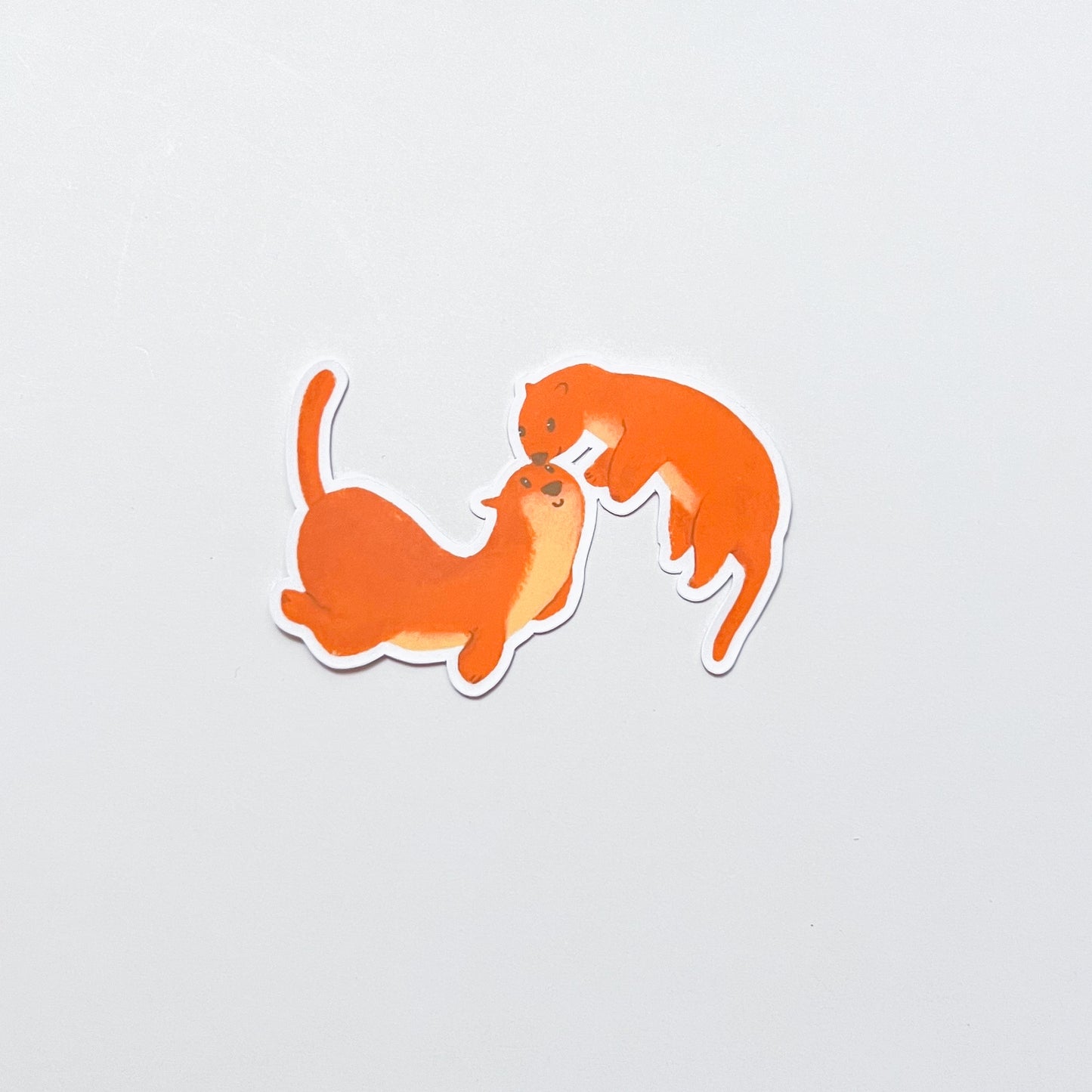 Two orange otters illustrations on a light gray background