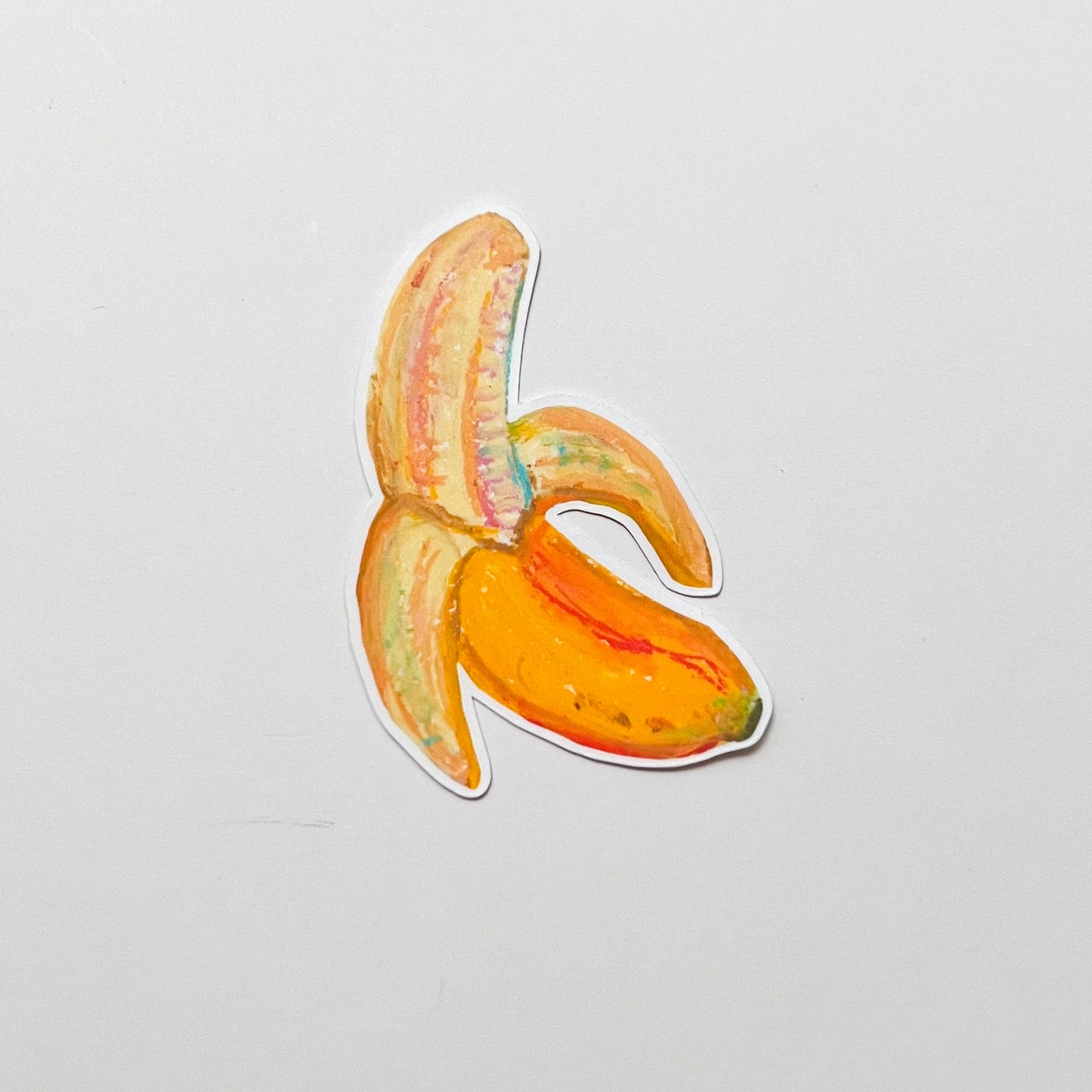 Sticker of a banana peel on a light gray background