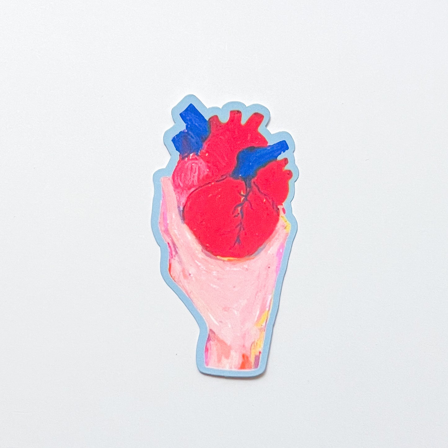 Sticker of a hand holding a red heart on a light gray background