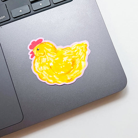 Yellow chicken sticker on a laptop