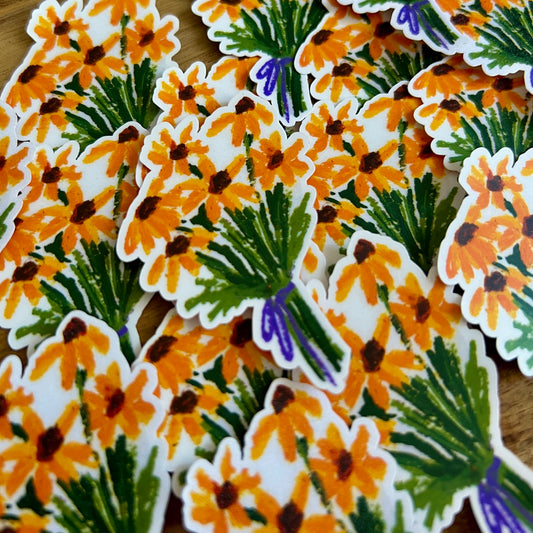 Stickers with yellow flower design on a wooden surface
