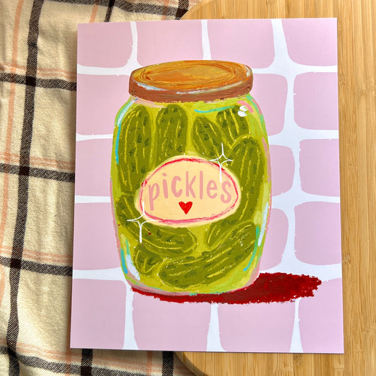 jar of pickles on a pink checkered background