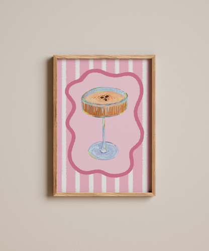 Framed artwork of a cocktail on a pink striped background