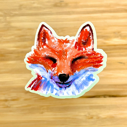 Sticker of a fox face on a wooden background