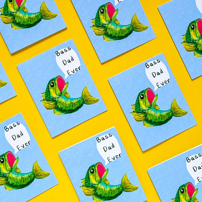 greeting cards with design of a bass fish and text 'bass dad ever' on it with yellow background