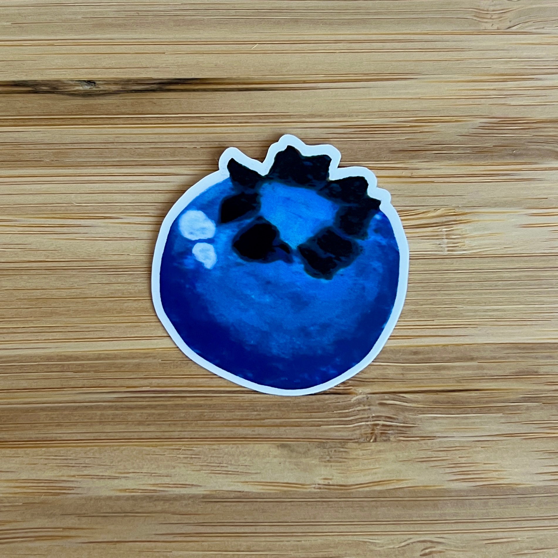 Blueberry sticker on a wooden surface