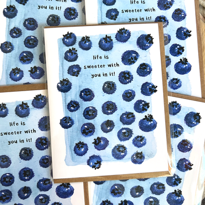 Greeting cards with blueberry pattern and text 'life is sweeter with you in it!' on a matching background.