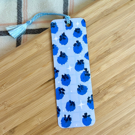 Bookmark with blueberry pattern on a wooden surface