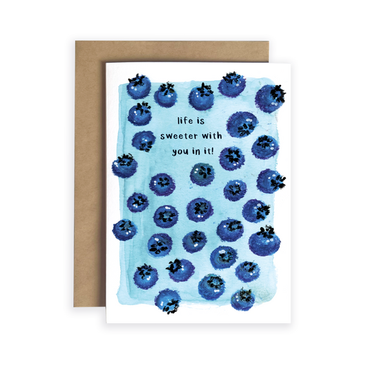 Greeting card with blueberry pattern and text 'life is sweeter with you in it!' on a white background.