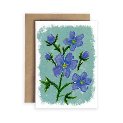 Greeting card with blue flowers on a light green background