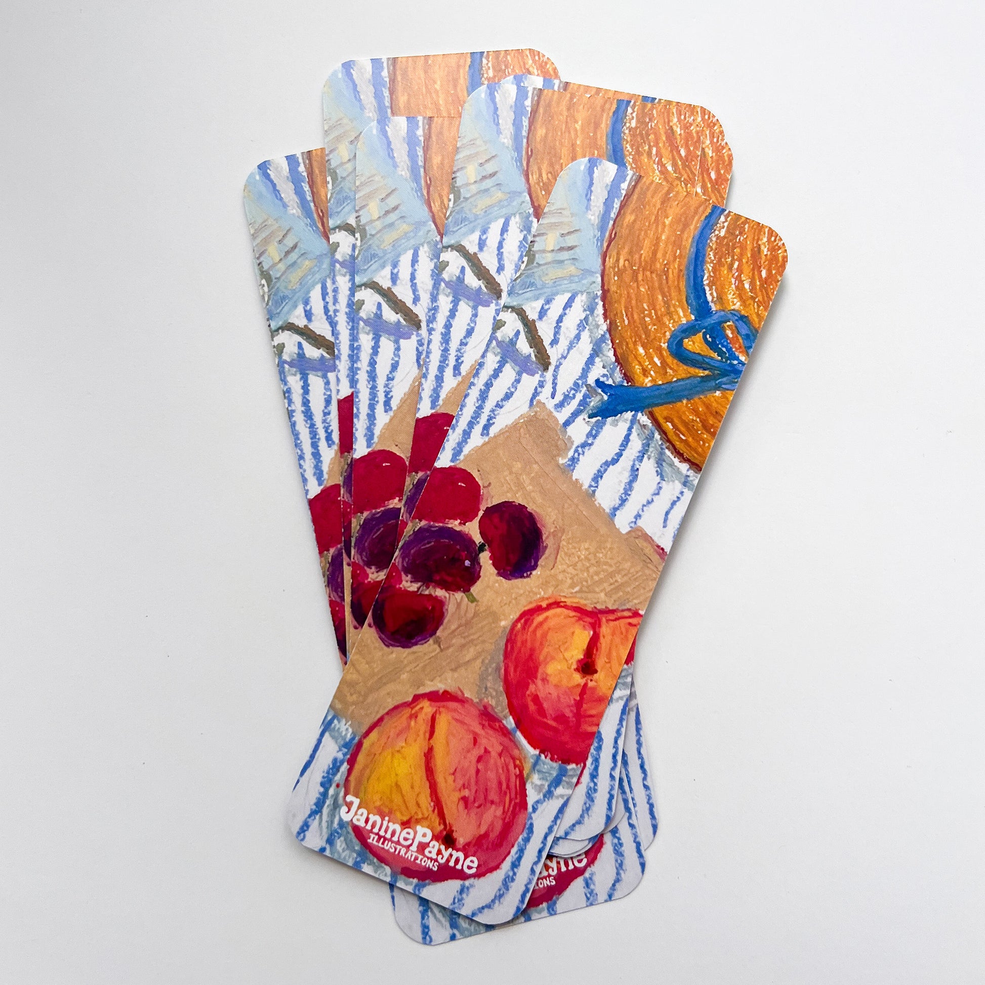 Set of three colorful bookmarks with artistic designs on a white background