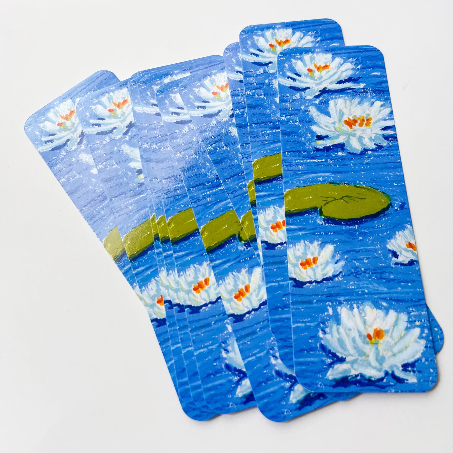 Set of bookmarks with waterlily design on a white background