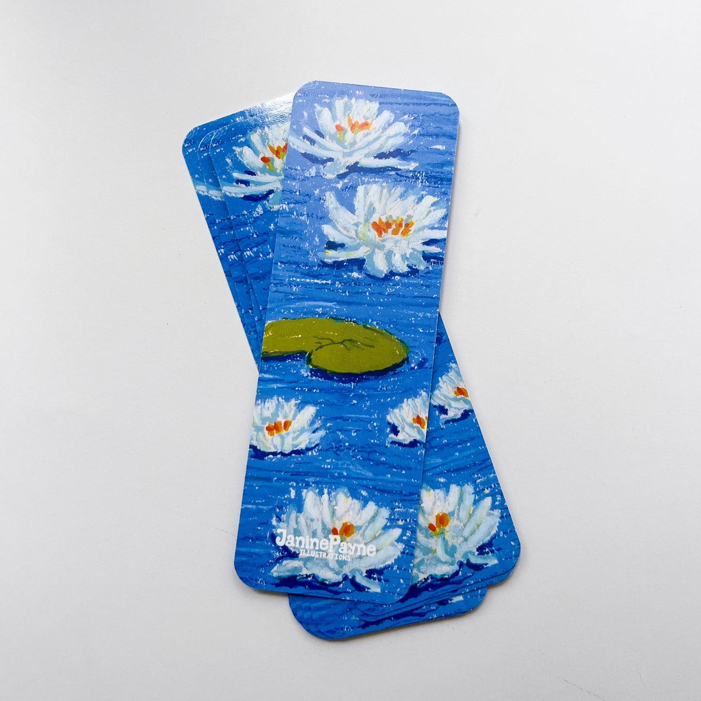 set of bookmarksvwith waterlily design on a white background