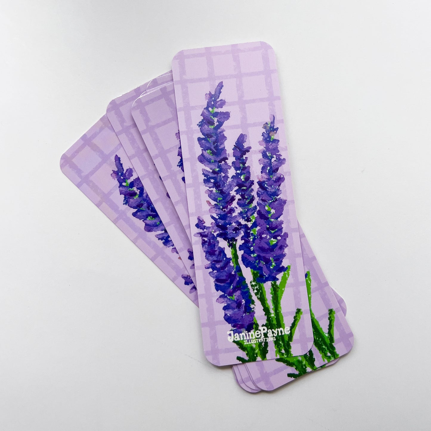 stack of lavender-themed bookmarks on a white background