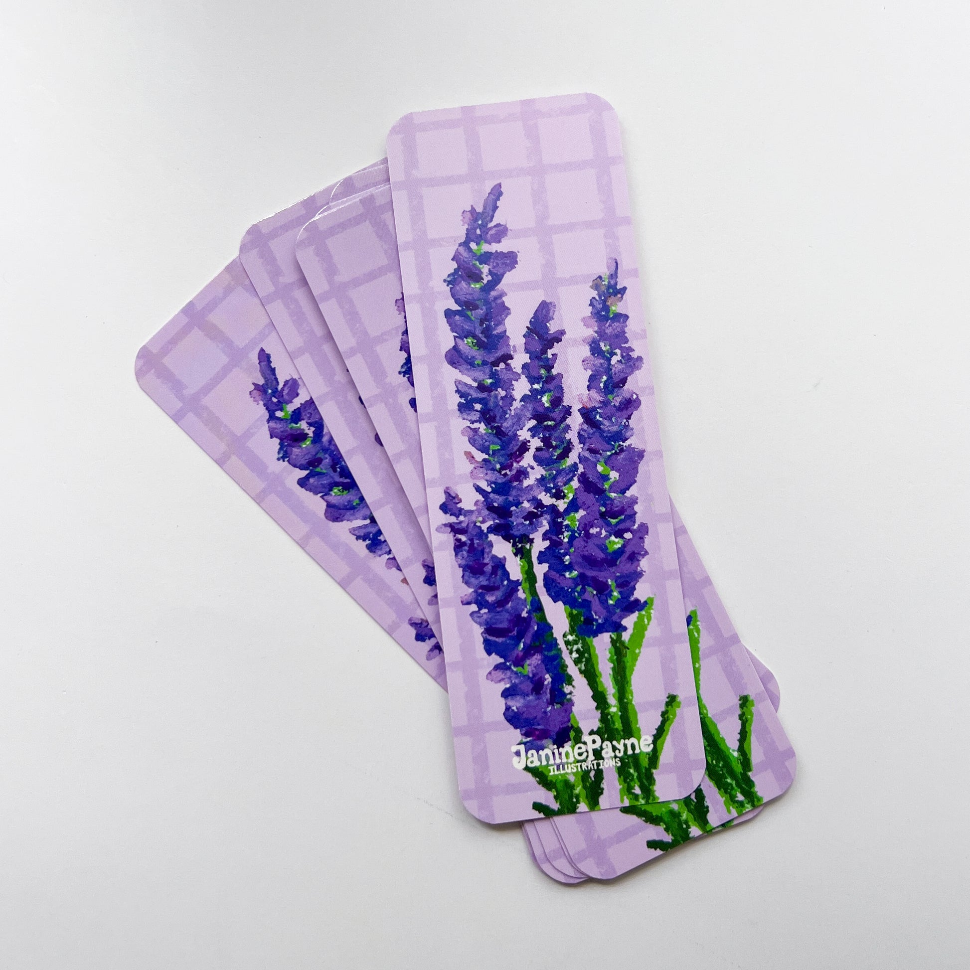 stack of lavender-themed bookmarks on a white background