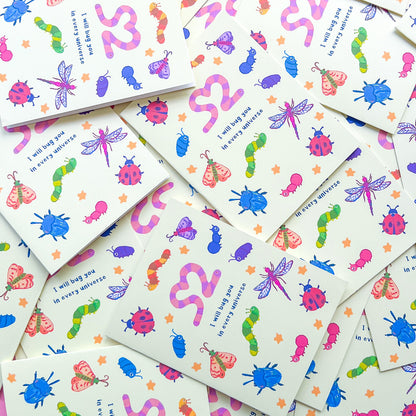 stack of greeting cards with an illustration of various bugs and text 'I will bug you in every universe' on white background