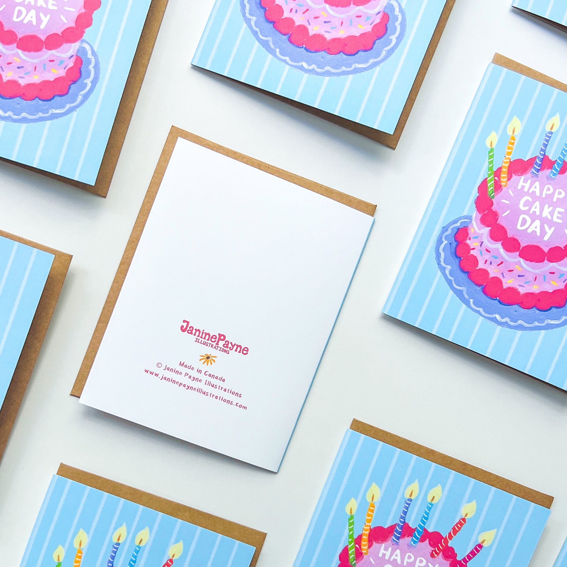 pattern of birthday cards with cake illustration and text 'happy cake day' against a white background and Janine Payne illustrations branding 