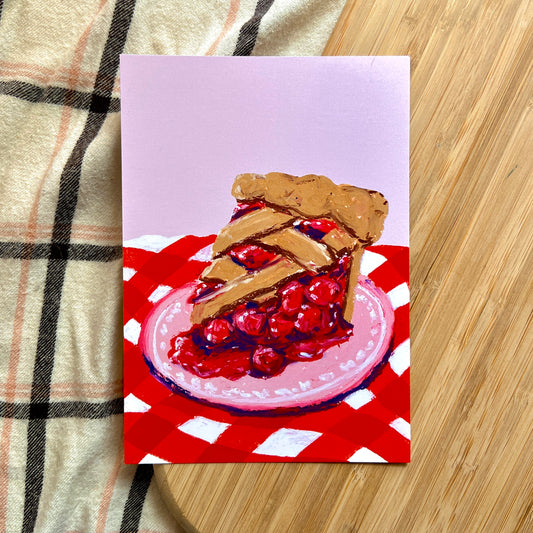 illustration of cherry pie on red checkered cloth 