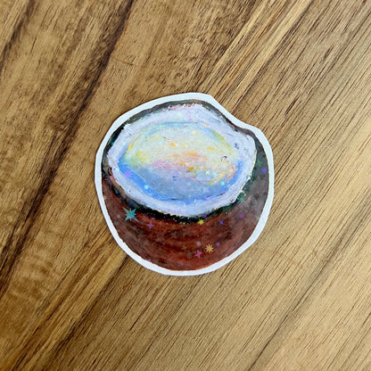 Sticker of a coconut on a wooden surface