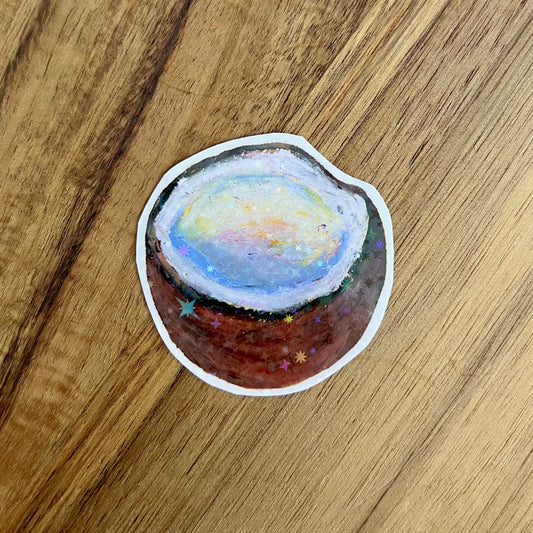 Sticker of a coconut on a wooden surface