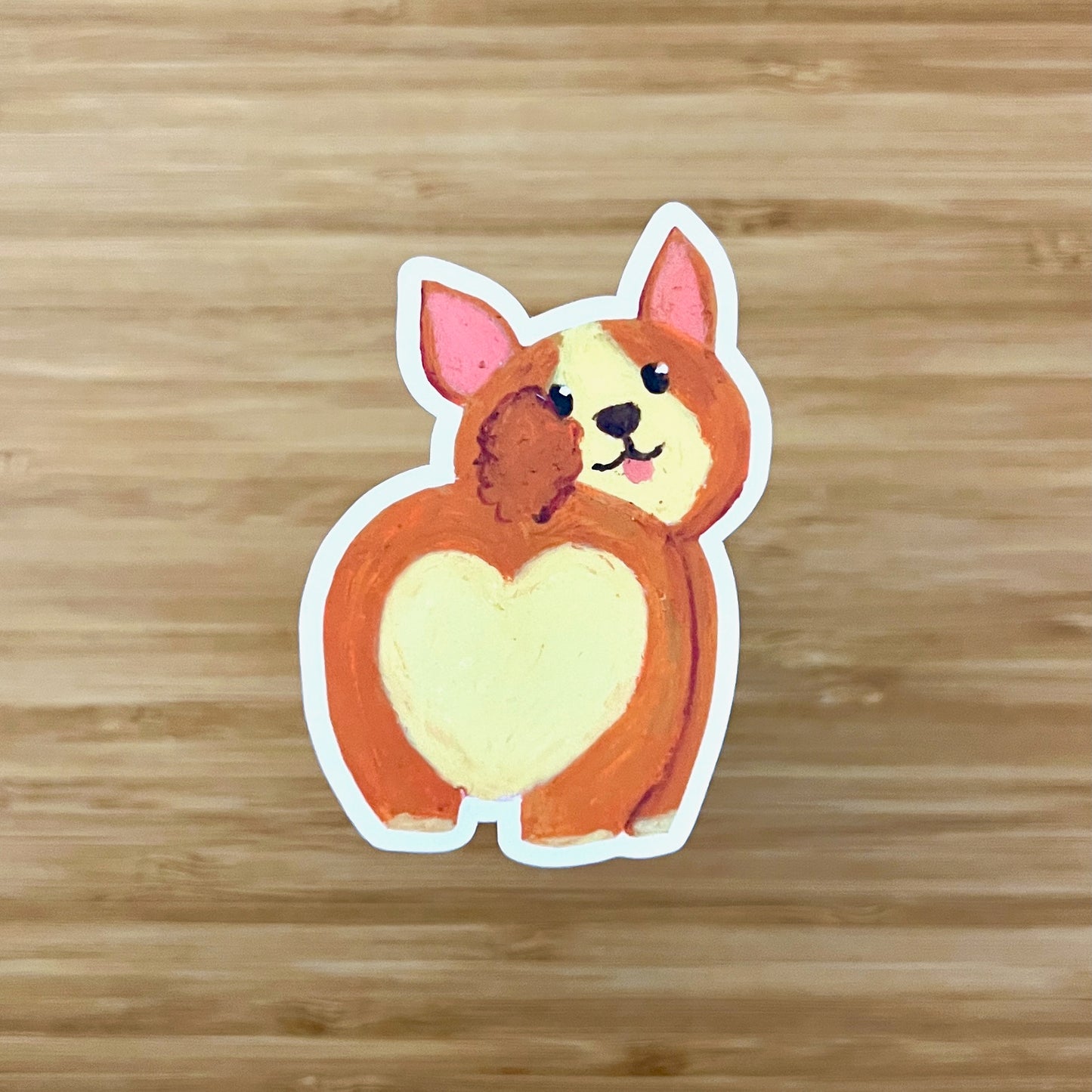 corgi butt sticker on wooden surface