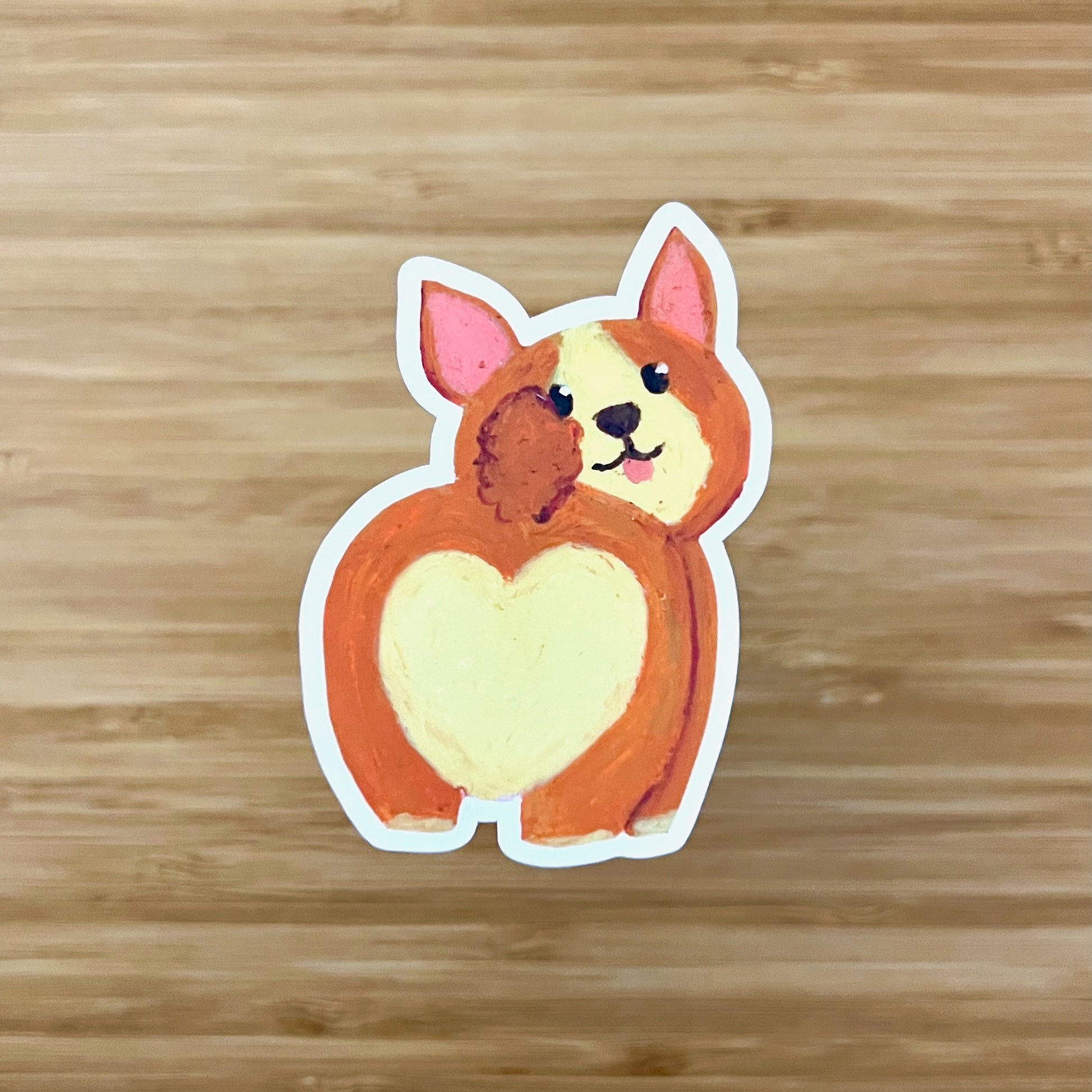 corgi butt sticker on wooden surface