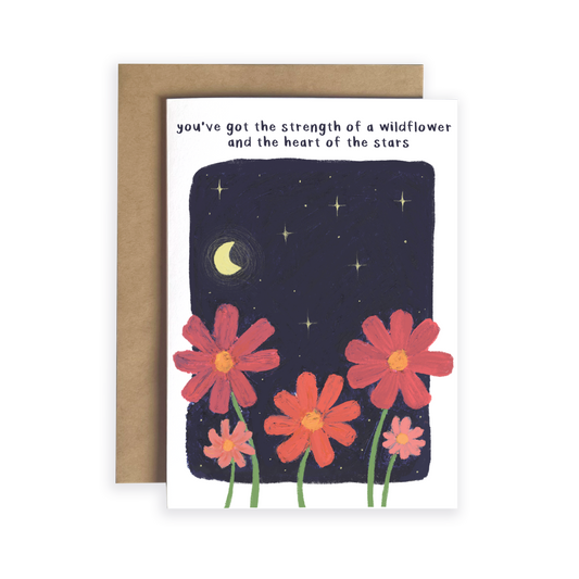 Greeting card with red flowers and starry night design, featuring a motivational quote.