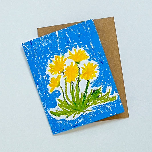 Greeting card with yellow flowers on a blue background, featuring a brown envelope.