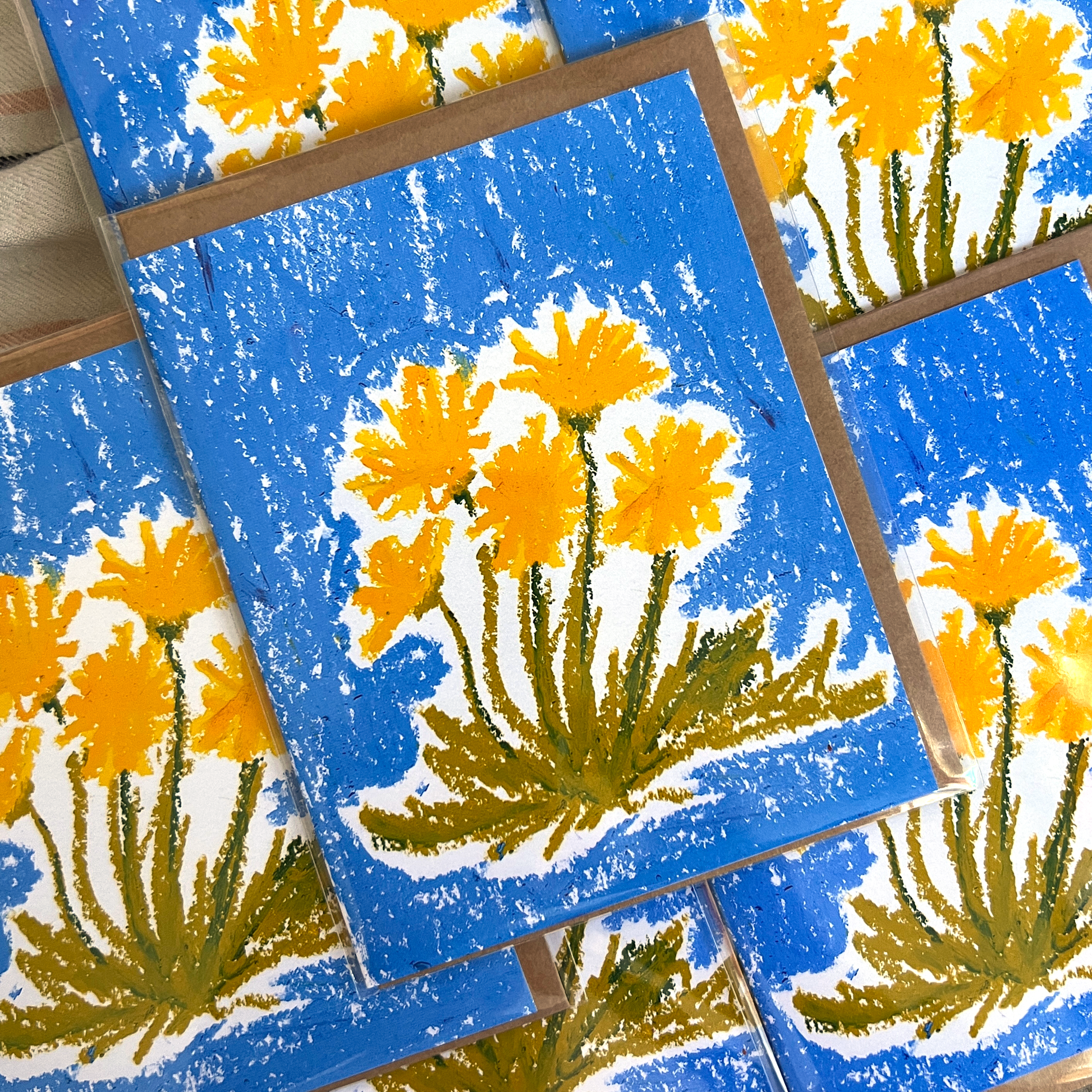 Greeting cards with yellow flower design on blue background