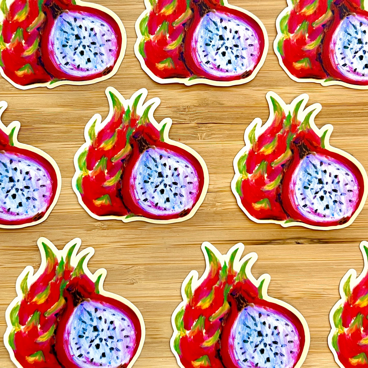 Sticker design of a dragon fruit cut in half on a wooden background