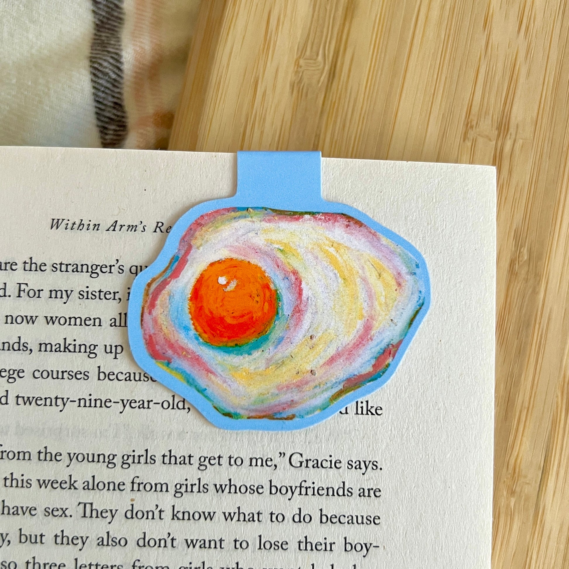 egg magnetic bookmark with a wooden surface in the background