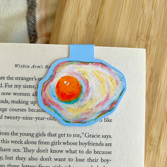 egg magnetic bookmark with a wooden surface in the background
